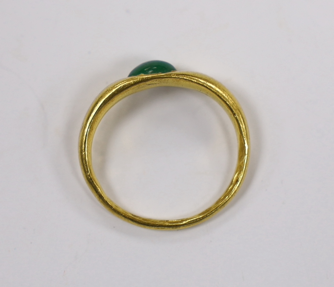 A Roman high carat yellow metal and single stone cabochon emerald set ring, size L, gross weight 3.7 grams, stone size approximately 6.9mm by 5.9mm.